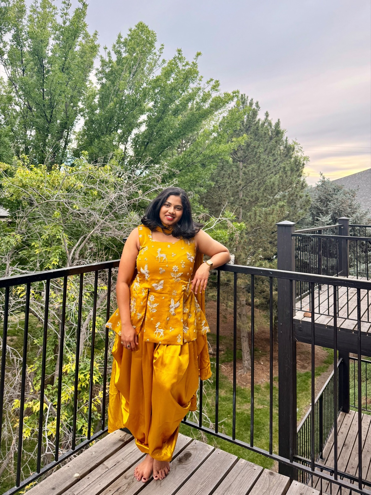 Kruthi wearing her custom mustard outfit