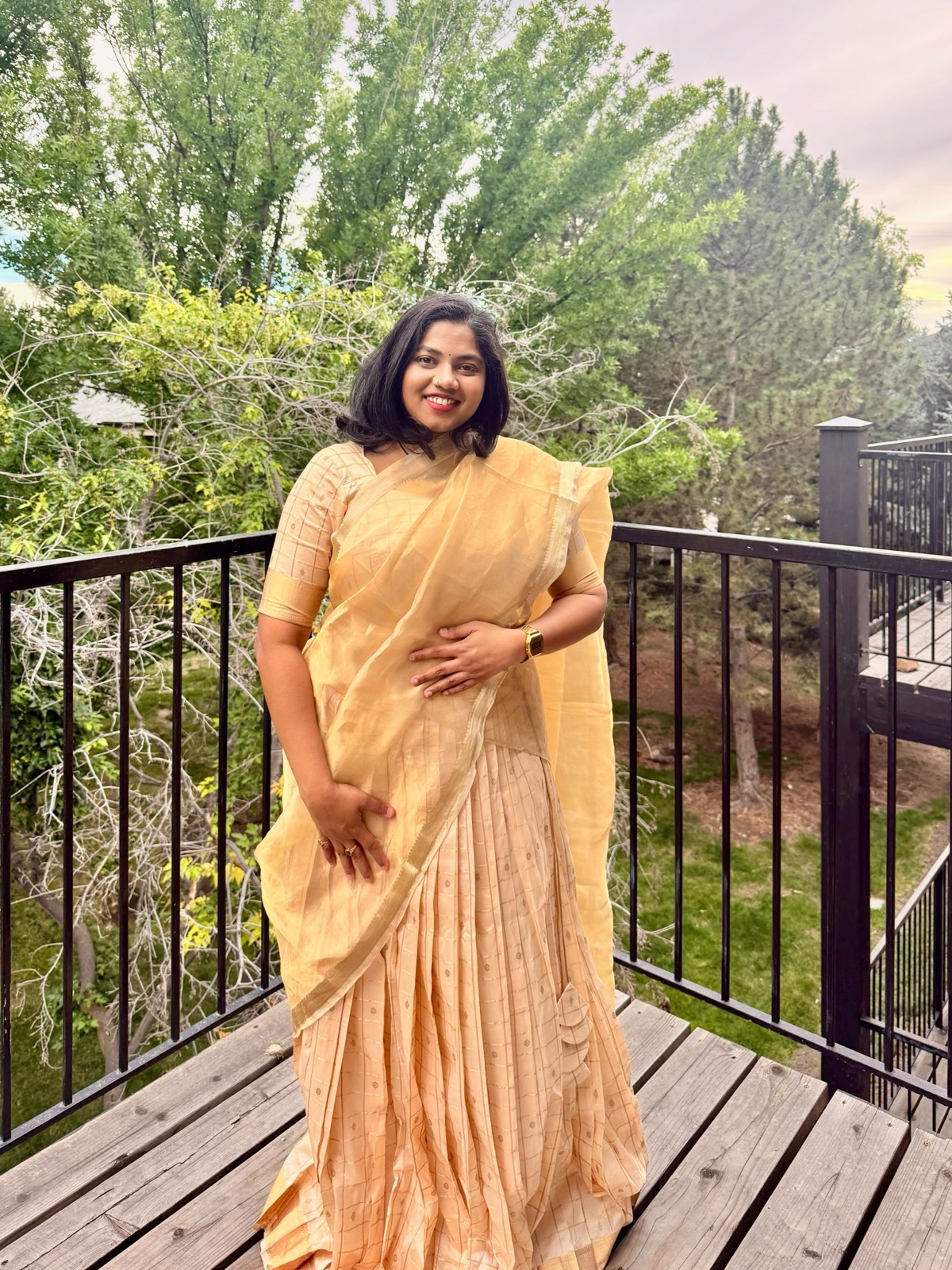 Kruthi wearing her custom peach outfit