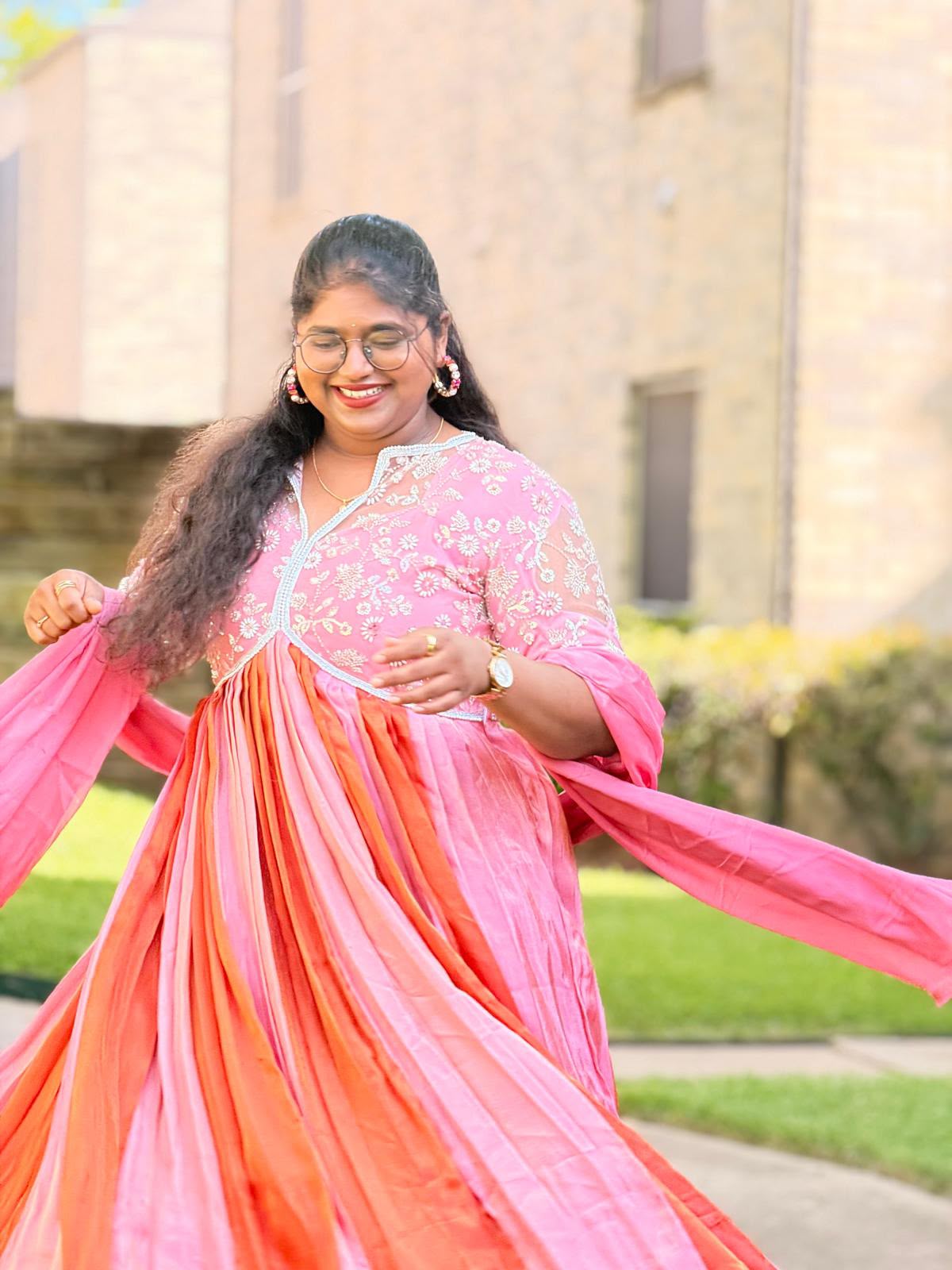 Sushma wearing her custom pink and orange outfit